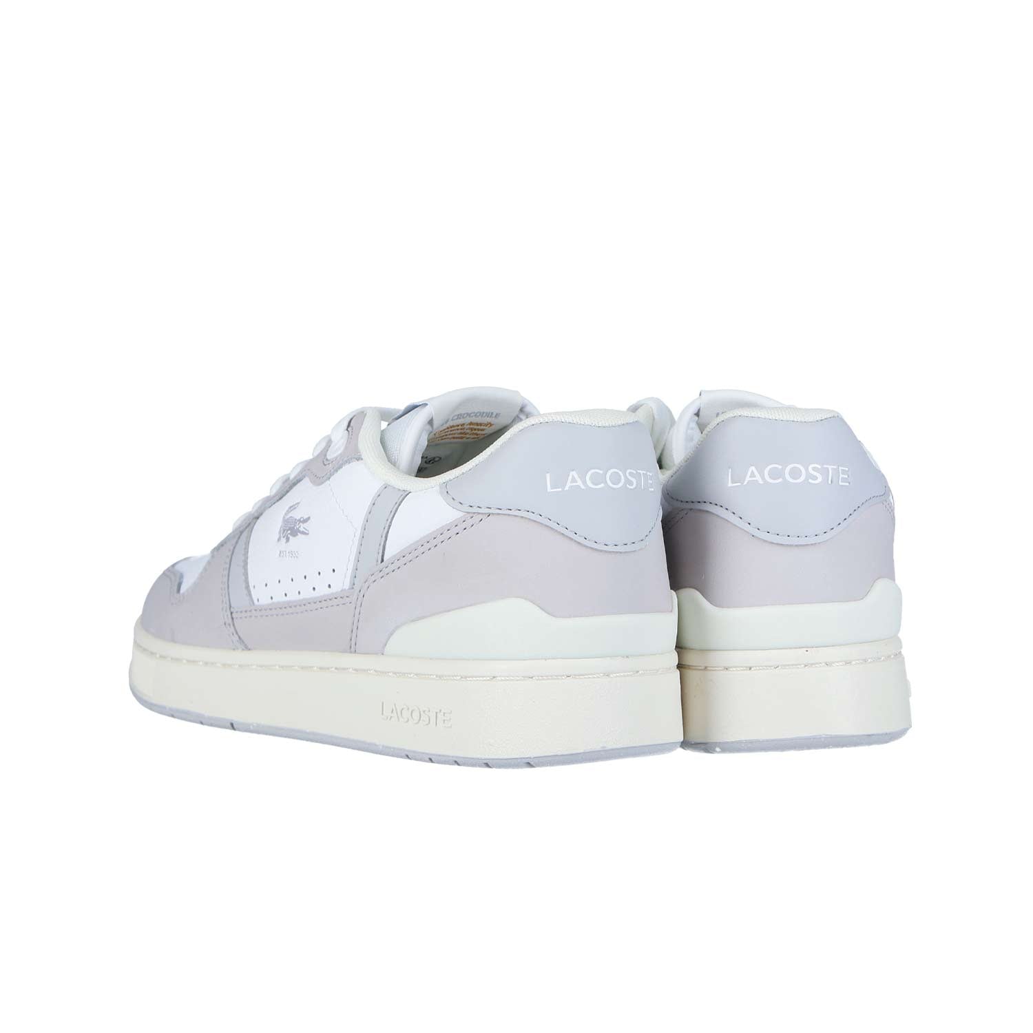 Die LACOSTE T-CLIP SET 224 6 SMA Sneakers in Weiß und Hellgrau sind mit dem Markennamen an der Ferse und dem Krokodil-Logo an der Seite versehen und verbinden sportliche Eleganz mit bequemer Passform.