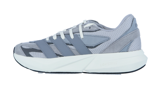 Der Adidas LIGHTBLAZE Sneaker in Hellgrau besteht aus Mesh und Wildleder, weißen Schnürsenkeln, einer dicken weiß-schwarzen Sohle mit LIGHTSTRIKE Zwischensohle und überlappenden grauen Seitenstreifen.