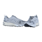 Ein Paar graue New Balance CM878V1 Sneakers mit weißer Zwischensohle, schwarzer Laufsohle und weißem N-Logo an den Seiten werden auf einem schlichten weißen Hintergrund gezeigt. Inklusive ABZORB-Dämpfung für zusätzlichen Komfort.