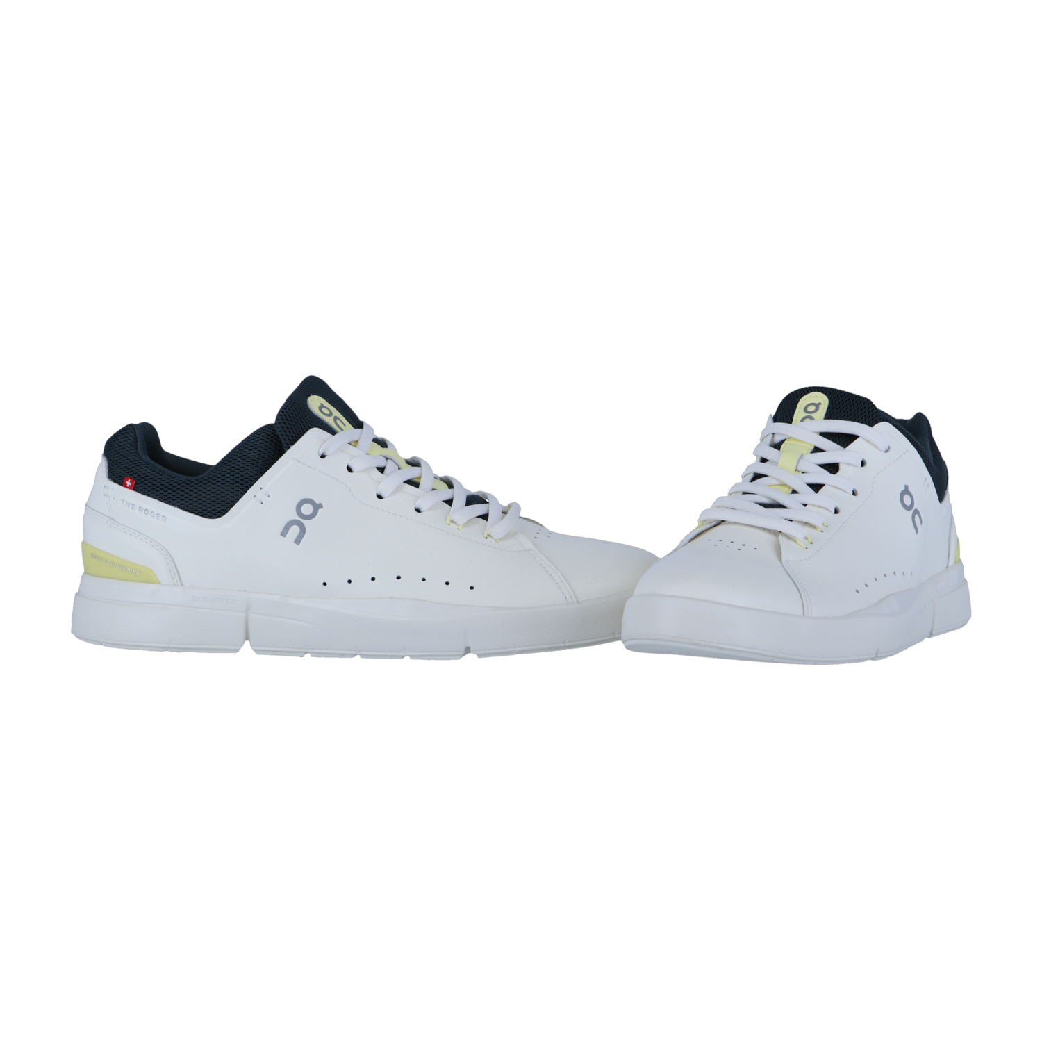 THE ROGER ADVANTAGE von On: Weiße Sport-Sneaker mit schwarzen und gelben Akzenten, gefertigt aus veganem Leder mit perforierten Seiten, Schnürung vorne und einem Low-Top-Design. Auf einfarbig weißem Hintergrund dargestellt.