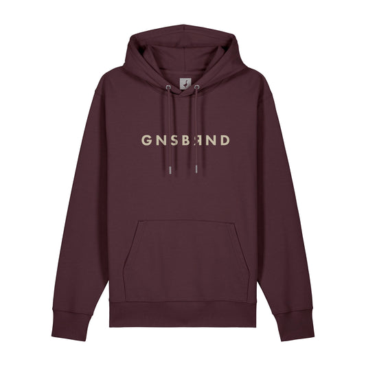 Der Aurach Hoodie von GNSBRND ist ein kastanienbrauner Unisex-Kapuzenpulli mit Fronttasche, Kordelzug und beigem "GNSBAND"-Aufdruck auf der Brust. Hergestellt aus weicher Bio-Baumwolle für ganztägigen Komfort.