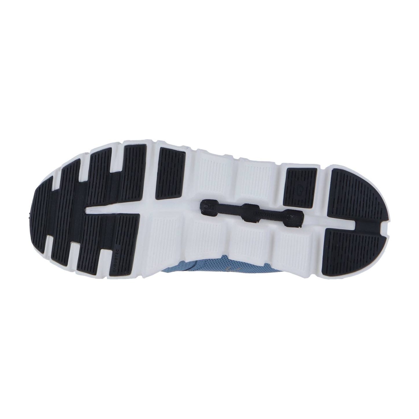 Das Bild zeigt die Unterseite der Sohle des On CLOUD 6, die ein schwarz-weißes, segmentiertes Gummiprofil in einem Gittermuster mit CloudTec-Dämpfung für verbesserte Traktion und Flexibilität aufweist.