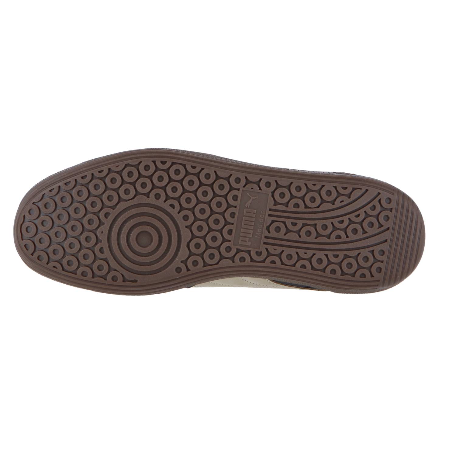 Das Bild zeigt die braune Gummisohle des Puma Palermo Pop mit einem kreisförmigen Profil, einem zentralen Puma-Logo und klassischen, von der Terrace-Kollektion inspirierten konzentrischen Kreisen und Wellenlinien für besseren Grip.